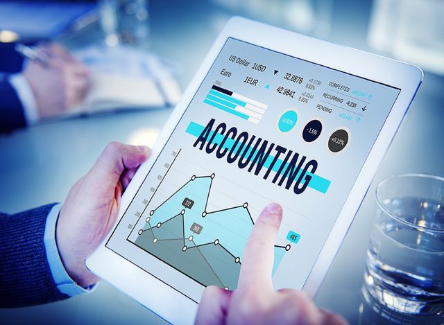 Tablet showing accounting charts and figures