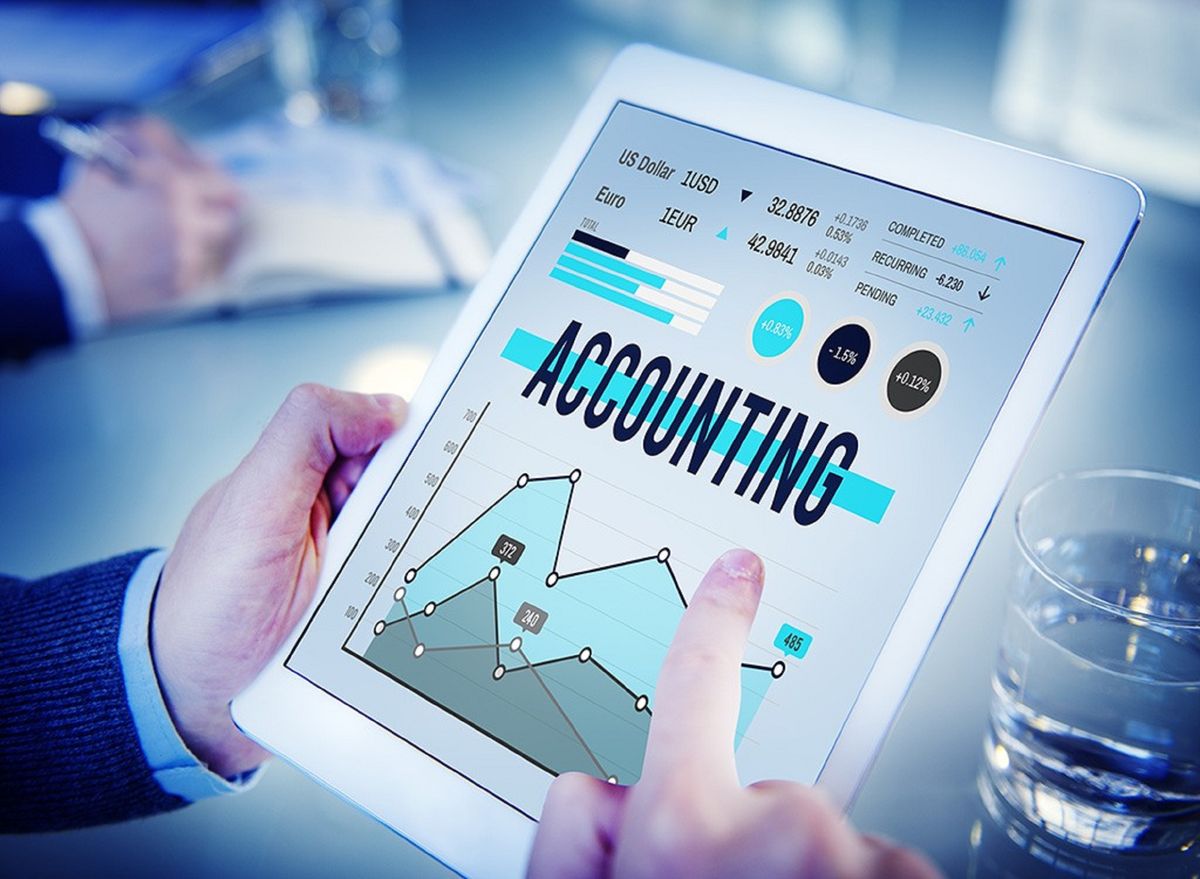 Tablet showing accounting charts and figures