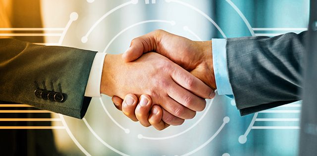 Two business partners shaking hands