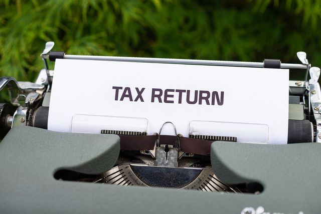 Typewriter with a sheet reading 'Tax return'